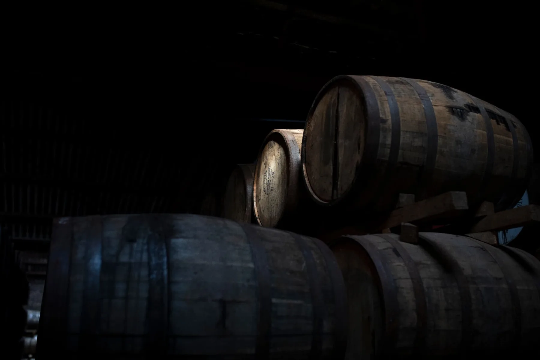 Rows of oak casks in the maturation warehouse